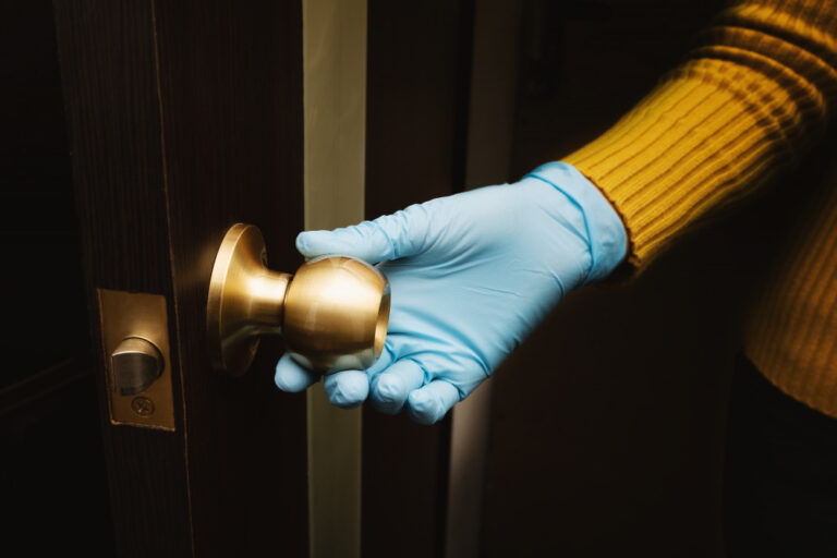 female-hand-protective-glove-open-door